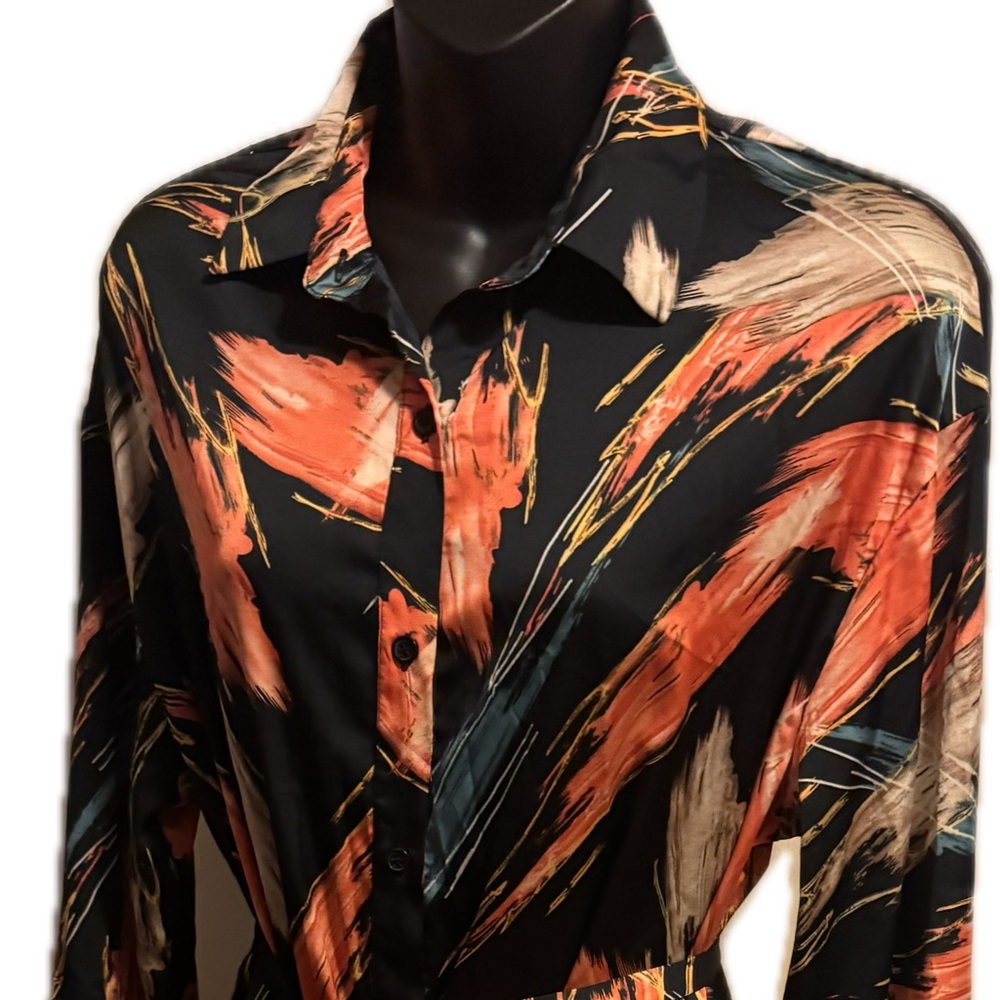 Women’s wrap fall color button up dress with belt.